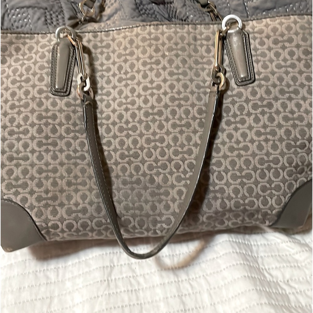 Gray and silver Coach purse